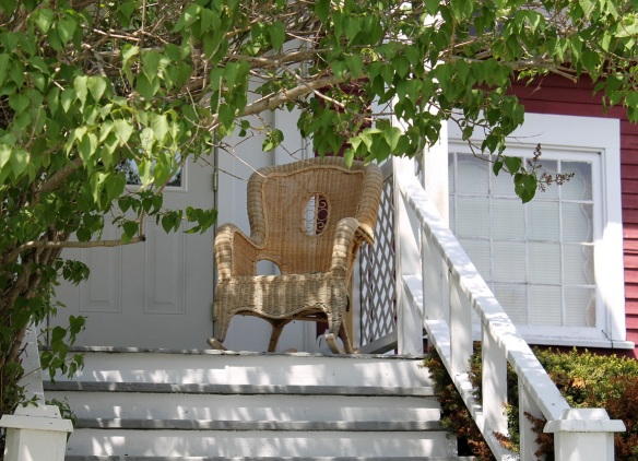 Loved this almost-hidden wicker chair on someone's front porch.  Great place to people watch!
