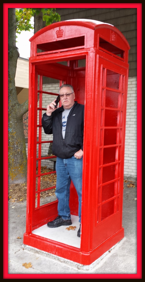 Karen Synder (Niles, MI): While on vacation in Suttons Bay, I came across this make shift phone booth.....remind you of anything? I took a picture of my husband Darrell in it. It didn't come out super clear.  We still missed our fall trip to the island. 
